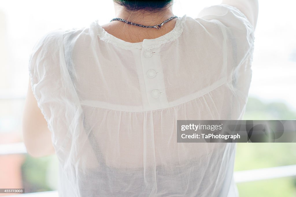 Woman in white blouse