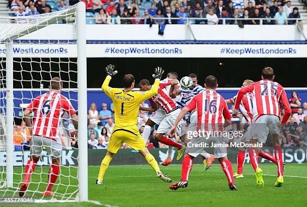 Steven Caulker of QPR heads towards goal on the way to scoring the opening goal during the Barclays Premier League match between Queens Park Rangers...