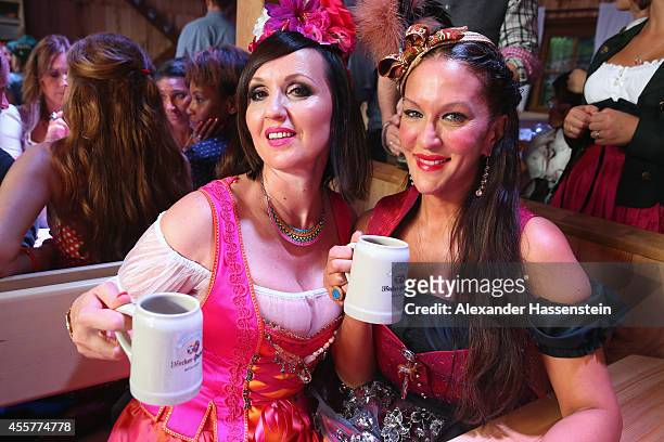 Allegra Curtis attends with Angelika Zwerenz the opening day at Fisch Baeder's Wiesenstadl of the 2014 Oktoberfest at Theresienwiese on September 20,...