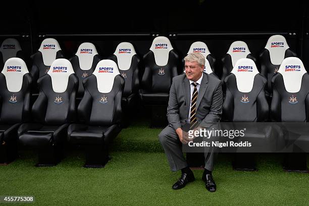 Steve Bruce the manager of Hull City sits in the dugout prior to kickoff during the Barclays Premier League match between Newcastle United and Hull...