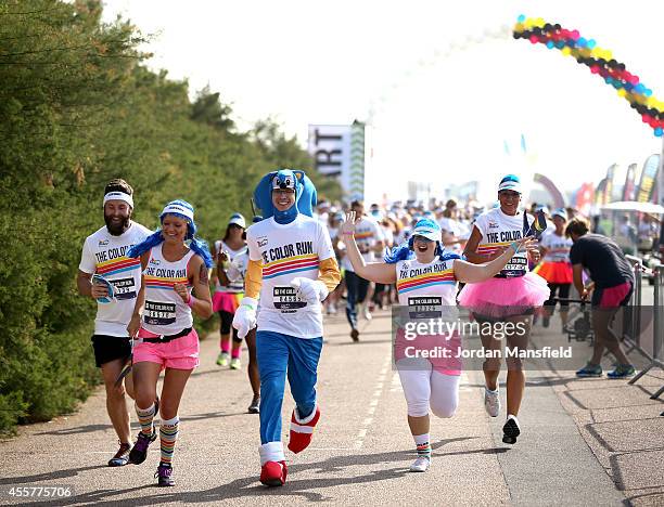 Runners take part in the Color Run presented by Dulux, known as the happiest 5km on the planet on September 20, 2014 in Brighton, England. Runners of...