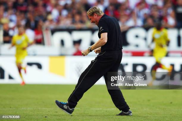 Head coach Markus Gisdol of Hoffenheim celebrates on the pitch after Tarik Elyounoussi scored his team's second goal during the Bundesliga match...