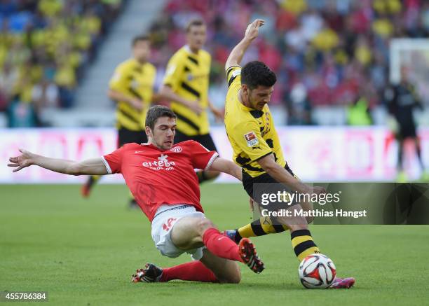 Stefan Bell of Mainz and Milos Jojic of Dortmund compete for the ball during the Bundesliga match between 1. FSV Mainz 05 and Borussia Dortmund at...