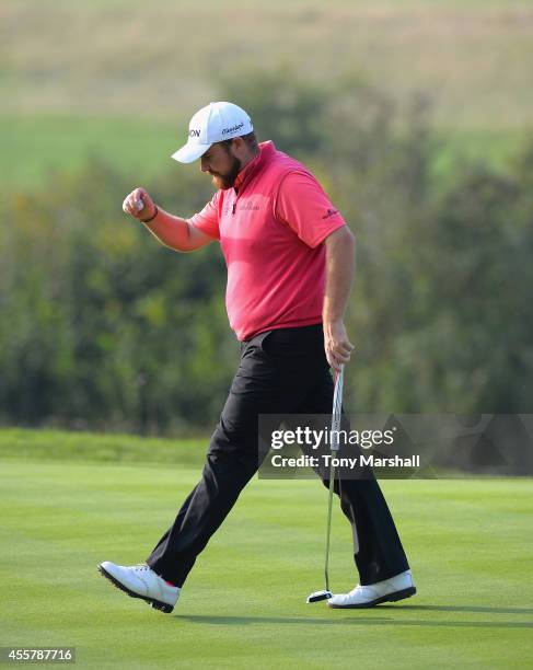 Shane Lowry of Ireland lines after sinking his putt on the 17th green during day three of the ISPS Handa Wales Open at Celtic Manor Resort on...