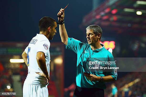 Referee Andy D'Urso shows Giuseppe Bellusci of Leeds Unietd a yellow card during the Sky Bet Championship match between AFC Bournemouth and Leeds...