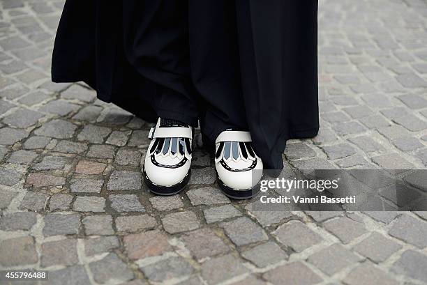 Linda Tol wears an Annie P dress and Pollini shoes on September 20, 2014 in Milan, Italy.