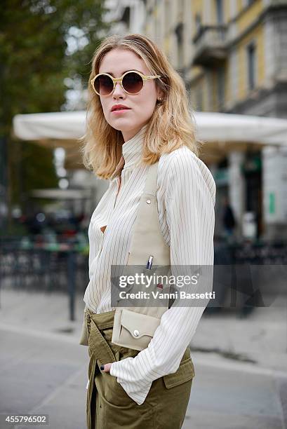 Annabel Rosendahl poses wearing a By Malene Birger shirt, Isabel Marant skirt, Triwa sunglasses and The Nilsen way gilet/bag on September 20, 2014 in...