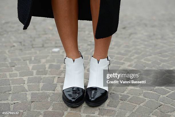 Natalia Georgala wears a Dimitris Petrou jacket and Senso shoes on September 20, 2014 in Milan, Italy.