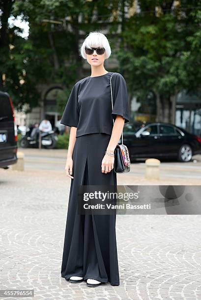 Linda Tol wears an Annie P dress, Pollini shoes and Paula Cademertaori bag on September 20, 2014 in Milan, Italy.