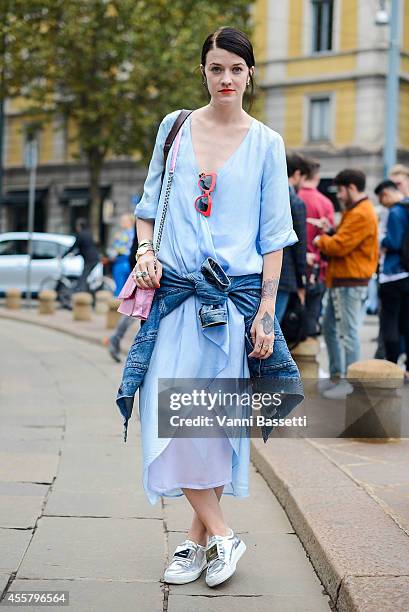 Marianne Theodorsen poses wearing Hunky Dory dress, Cala & Jade bag, Prada sunglasses and Acne shoes on September 20, 2014 in Milan, Italy.