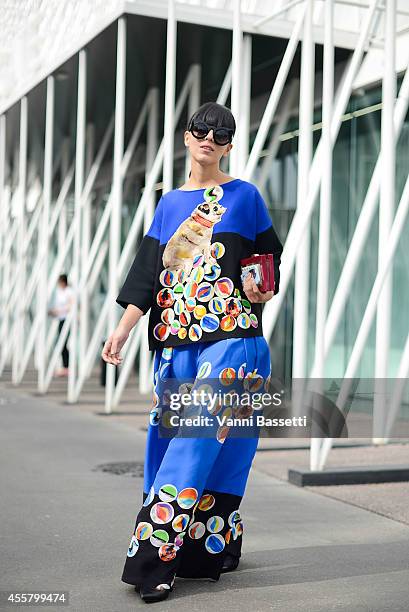 Laura Comolli wears a Giulia Rositani dress and Thale Blanc bag on September 20, 2014 in Milan, Italy.