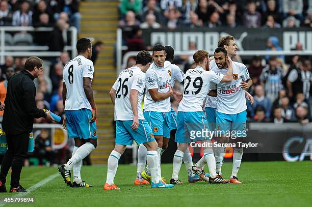 Hull players celebrate after Mohamed Diame scores the second goal during the Barclays Premier League match between Newcastle United and Hull City at...