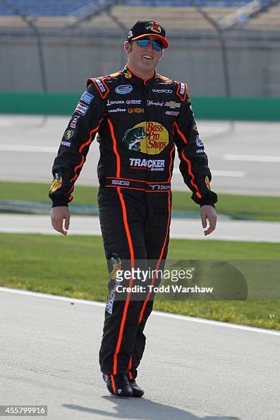 Ty Dillon, driver of the Bass Pro Shops Chevrolet, walks on the grid during qualifying for the NASCAR Nationwide Series VisitMyrtleBeach.com 300 at...