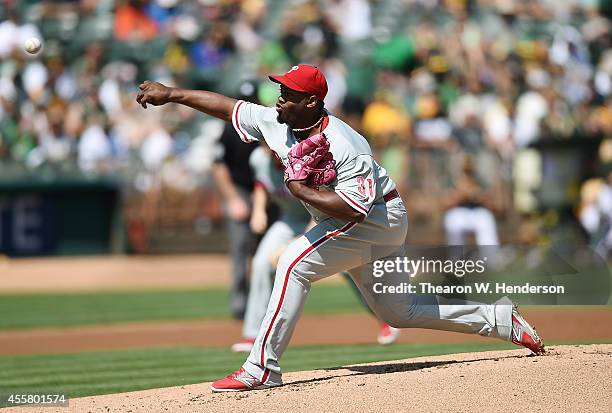 Jerome Williams of the Philadelphia Phillies pitches against the Oakland Athletics in the bottom of the first inning at O.co Coliseum on September...