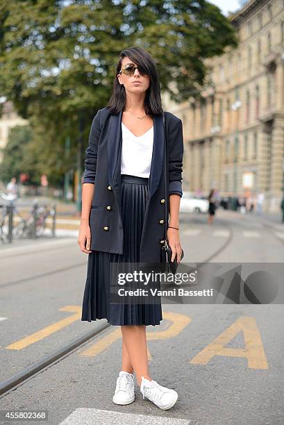 Lucia Yanez poses wearing a Zara total look, Adidas shoes and YSL sunglasses on September 20, 2014 in Milan, Italy.