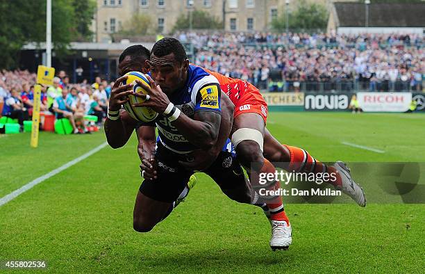 Semesa Rokoduguni of Bath scores the opening try past Vereniki Goneva of Leicester Tigers during the Aviva Premiership match between Bath and...