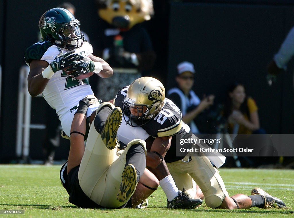 The University of Colorado football team takes on the Hawai'i Rainbow Warriors at Folsom Field in Boulder on Sept. 20, 2014.