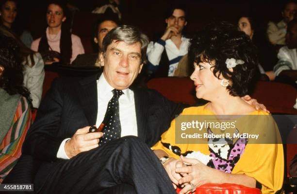 Married couple American politician John Warner and actress Elizabeth Taylor attend a Michaele Vollbracht fashion show, New York, 1981.