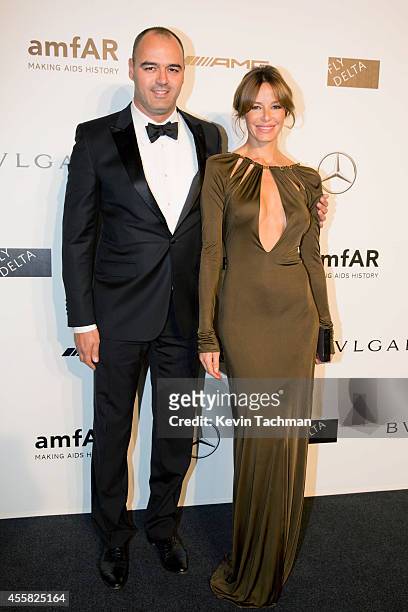 Milutin Gatsby and Carolina Parsons attend amfAR Milano 2014 event during Milan Fashion Week Womenswear Spring/Summer 2015 on September 20, 2014 in...