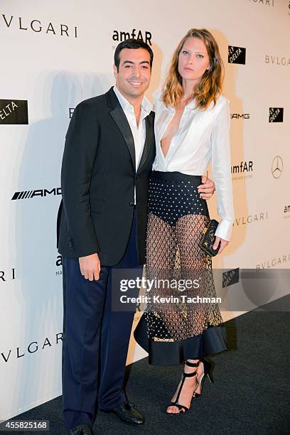 Mohammed Al Turki and Catherine McNeil attend amfAR Milano 2014 event during Milan Fashion Week Womenswear Spring/Summer 2015 on September 20, 2014...