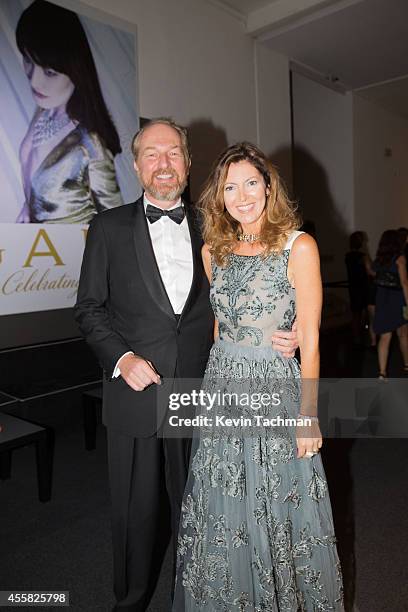 Arturo Artom and Alessandra Repini attend the amfAR Milano 2014 cocktail party as part of Milan Fashion Week Womenswear Spring/Summer 2015 on...