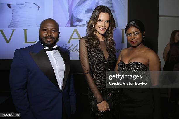 Franklin Eugene, Taylor Re' Lynn and Alessandra Ambrosio attends the amfAR Milano 2014 - Cocktail as part of Milan Fashion Week Womenswear...