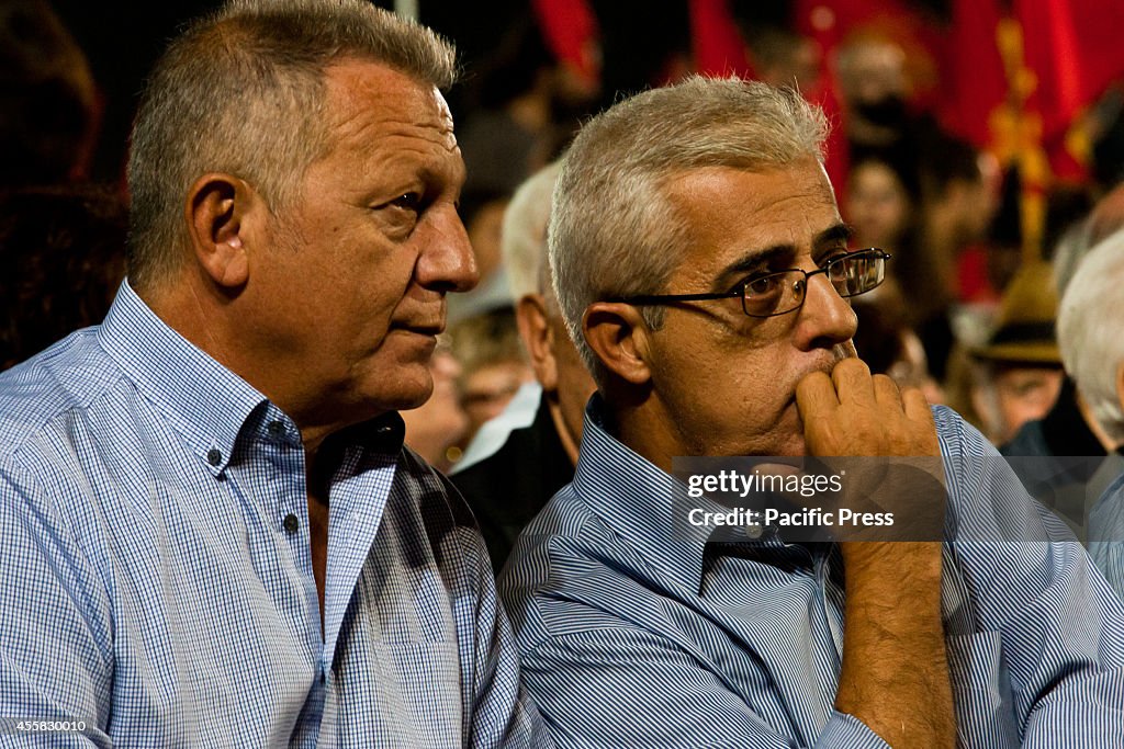 Historical member of Party, Thanasis Pafilis (L) is seen...