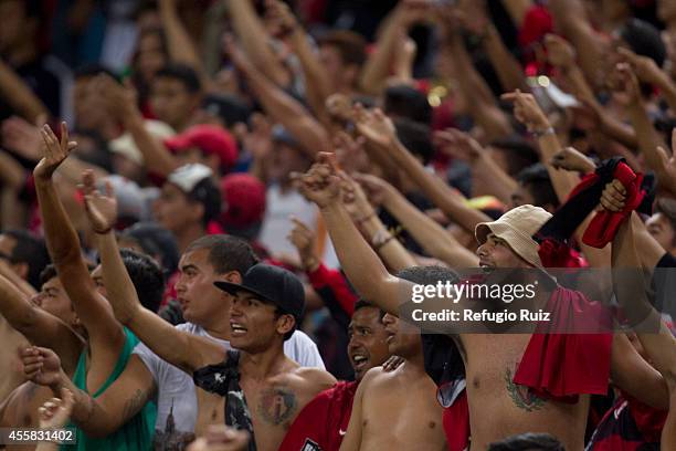 Fans of Atlas cheer for their team in the stands during a match between Atlas and Cruz Azul as part of 9th round Apertura 2014 Liga MX at Jalisco...