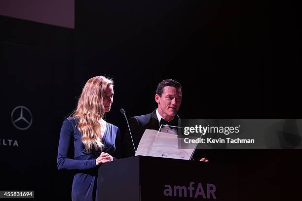 Fiammetta Cicogna and Luke Evans appear on stage during the amfAR Milano 2014 - Gala Dinner and Auction as part of Milan Fashion Week Womenswear...