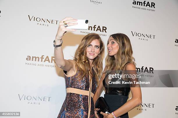 Chiara Ferragni and Candela Novembre attend amfAR Milano 2014 event during Milan Fashion Week Womenswear Spring/Summer 2015 on September 20, 2014 in...