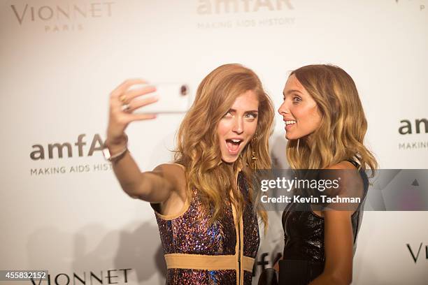 Chiara Ferragni and Candela Novembre attend amfAR Milano 2014 event during Milan Fashion Week Womenswear Spring/Summer 2015 on September 20, 2014 in...