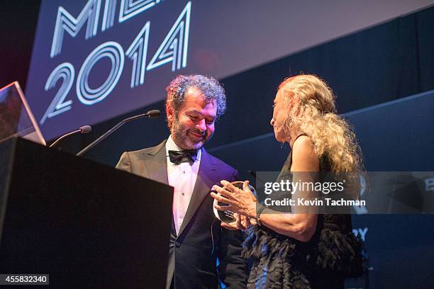 Remo Ruffini and Franca Sozzani appear on stage during the amfAR Milano 2014 - Gala Dinner and Auction as part of Milan Fashion Week Womenswear...