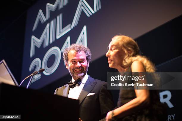 Remo Ruffini and Franca Sozzani appear on stage during the amfAR Milano 2014 - Gala Dinner and Auction as part of Milan Fashion Week Womenswear...