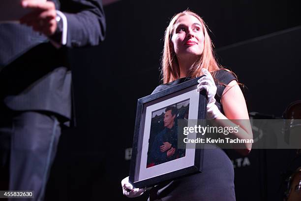 Items are auctioned off during the amfAR Milano 2014 - Gala Dinner and Auction as part of Milan Fashion Week Womenswear Spring/Summer 2015 on...