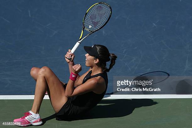 Ana Ivanovic of Serbia celebrates a point against Caroline Wozniacki of Denmark during the women's singles final on day seven of the Toray Pan...