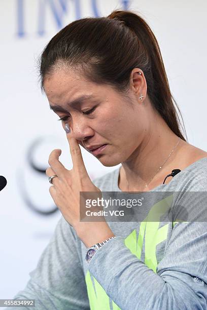 Li Na speaks to the media during a press conference after announcing her retirement at the National Tennis Centre on September 21, 2014 in Beijing,...
