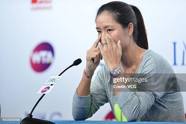 Li Na speaks to the media during a press conference after announcing her retirement at the National Tennis Centre on September 21, 2014 in Beijing,...