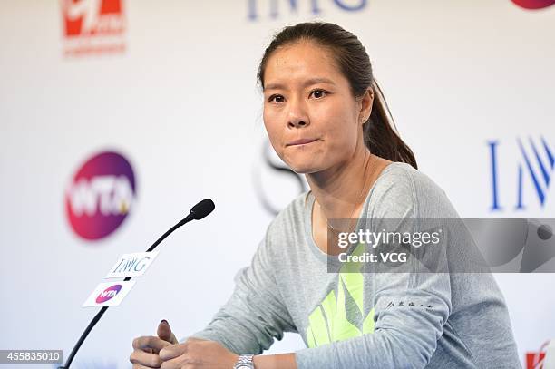 Li Na speaks to the media during a press conference after announcing her retirement at the National Tennis Centre on September 21, 2014 in Beijing,...