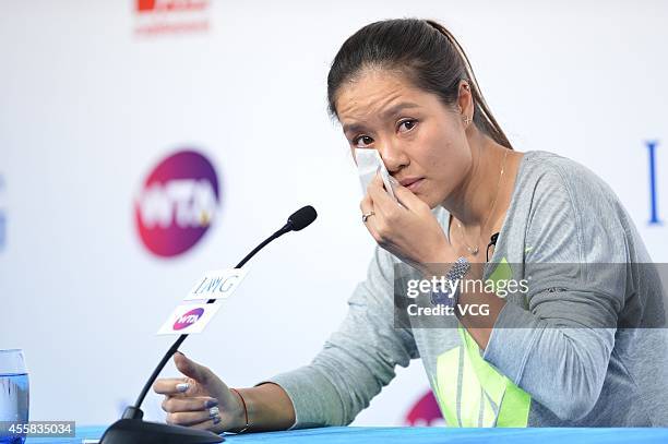 Li Na speaks to the media during a press conference after announcing her retirement at the National Tennis Centre on September 21, 2014 in Beijing,...