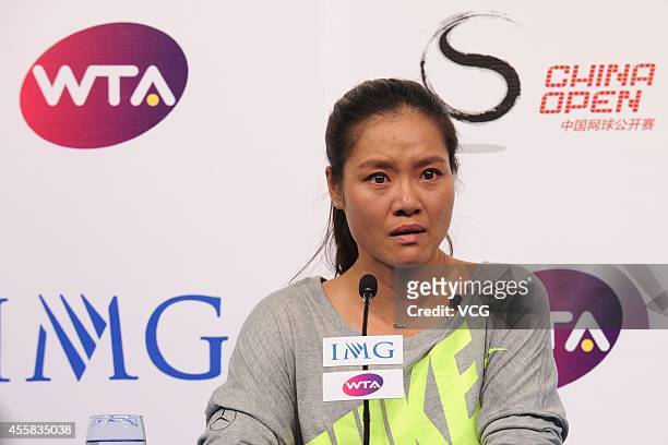 Li Na speaks to the media during a press conference after announcing her retirement at the National Tennis Centre on September 21, 2014 in Beijing,...