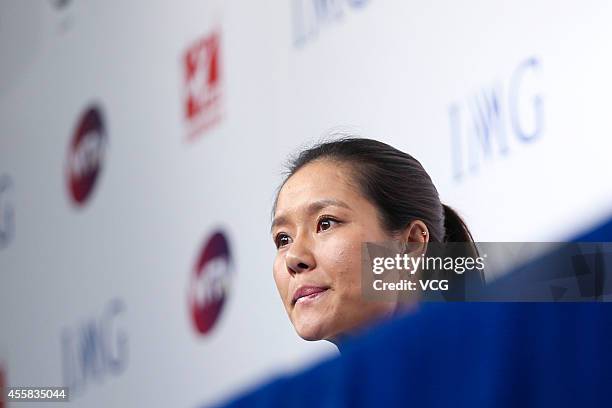 Li Na speaks to the media during a press conference after announcing her retirement at the National Tennis Centre on September 21, 2014 in Beijing,...