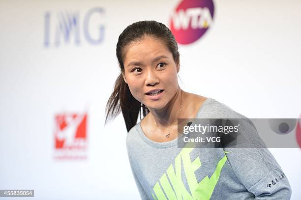 Li Na speaks to the media during a press conference after announcing her retirement at the National Tennis Centre on September 21, 2014 in Beijing,...