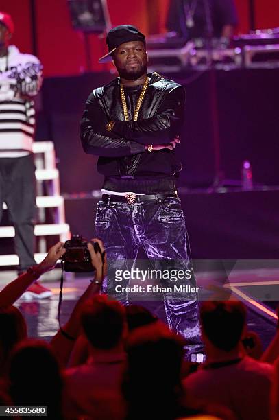 Rapper 50 Cent performs with G-Unit onstage during the 2014 iHeartRadio Music Festival at the MGM Grand Garden Arena on September 20, 2014 in Las...