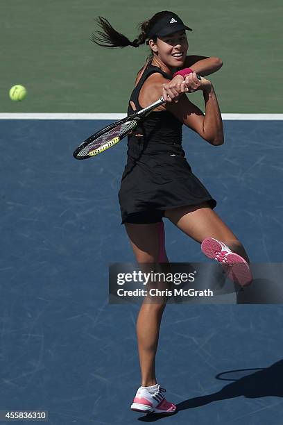 Ana Ivanovic of Serbia returns a shot against Caroline Wozniacki of Denmark during the women's singles final on day seven of the Toray Pan Pacific...