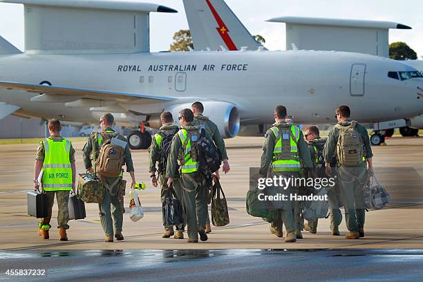 In this handout image provided by Commonwealth of Australia, air crew prepare to board the the E-7A Wedgetail Airborne Early Warning and Control...