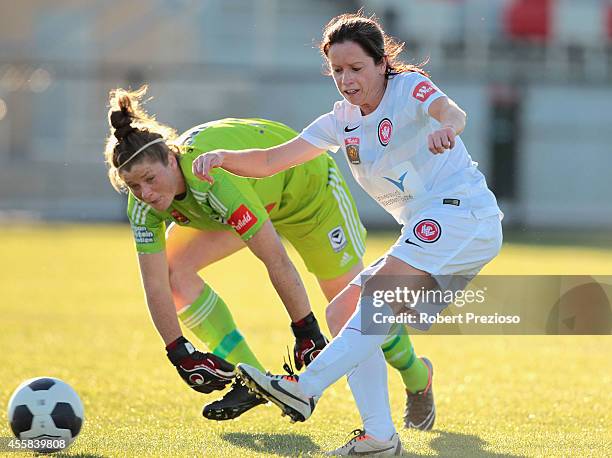 Michelle Carney of the Wanderers scores a goal after beating goal keeper Brianna Davey of the Victory during the round two W-League match between the...