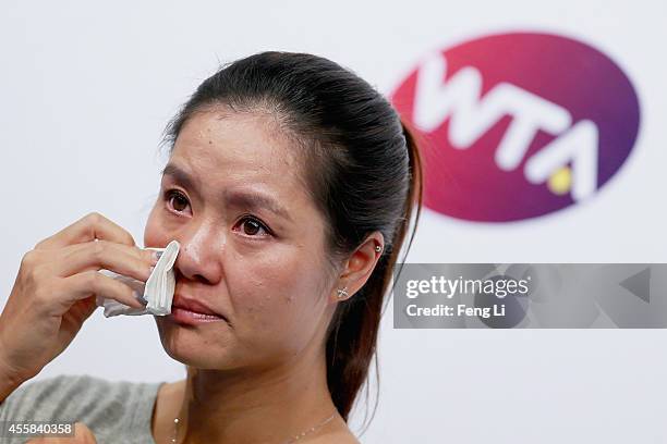 Chinese tennis player Li Na cries during her retirement press conference at the National Tennis Centre on September 21, 2014 in Beijing, China. The...