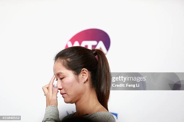 Chinese tennis player Li Na cries during her retirement press conference at the National Tennis Centre on September 21, 2014 in Beijing, China. The...