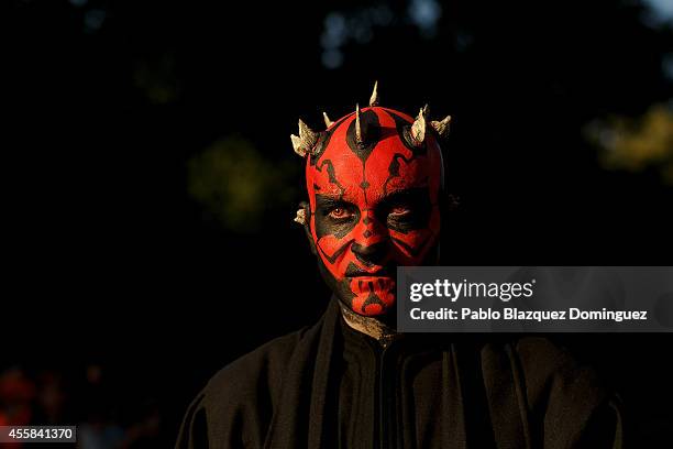 Reveler dressed as Darth Maul takes part in a Star Wars parade at the Retiro Park on September 20, 2014 in Madrid, Spain. The parade was part of a...