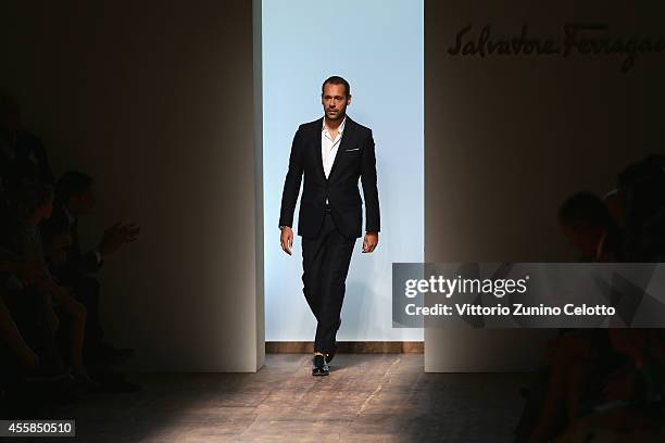 Italian designer Massimiliano Giornetti acknowledges the applause of the public after the Salvatore Ferragamo show as a part of the Milan Fashion...